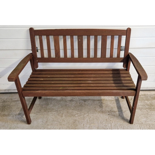 1420 - A modern dark wood slatted garden bench, painted brown. Approx. 89cm tall x 121cm long.