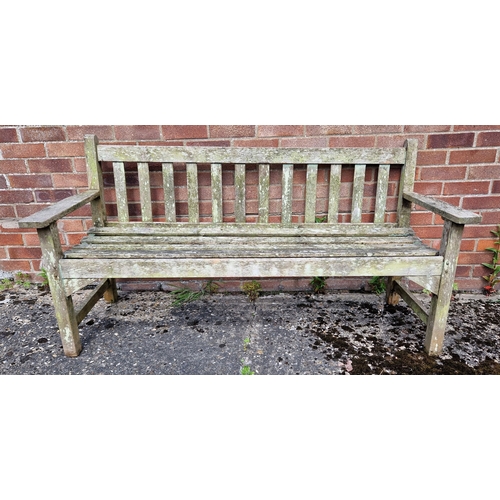 1432 - A wooden slatted garden bench. Approx. 159cm long.