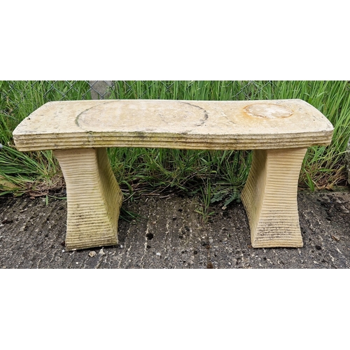 1437 - A 3 piece concrete garden bench of abstract design. Approx. 41cm tall x 92cm long.