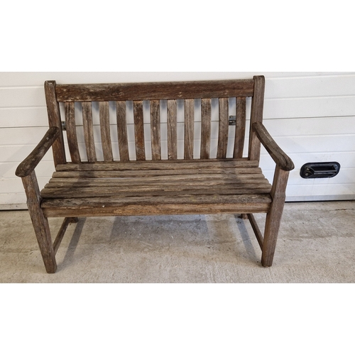 1440 - An Alexander Rose wooden garden bench with slatted seat and curved back. Manufacturers name plaque f... 