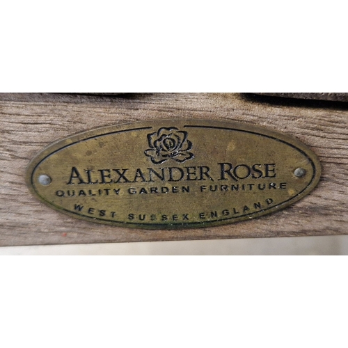 1440 - An Alexander Rose wooden garden bench with slatted seat and curved back. Manufacturers name plaque f... 