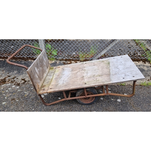 1443 - A vintage metal framed hand cart/wheel barrow with wooden boards and rubber tyres. Approx. 158cm lon... 