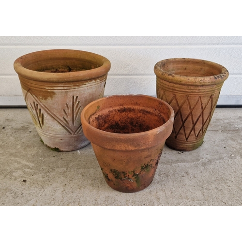 1447 - 3 assorted terracotta garden planters of varying sizes and designs. Largest approx. 18cm tall x 29.5... 