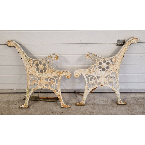 1449 - A pair of vintage cast iron bench ends, painted white, of scroll & foliate design with lions head de... 