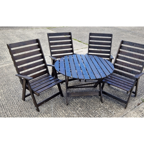 1459 - A wooden slatted folding garden table and 4 matching armchairs, painted brown. Damage to 1 chair, on... 