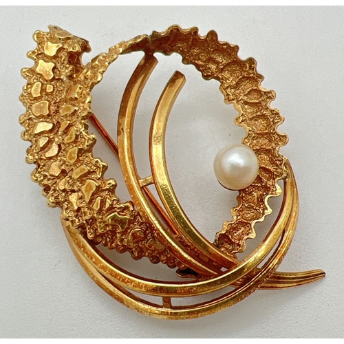 1126 - A vintage 1960's rolled gold brooch set with a single pearl. Retro twist and swirl design with both ... 