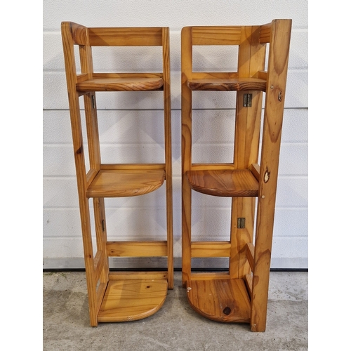 1403 - 2 pine 3 tier corner folding shelves. Each approx. 94cm x 26cm.