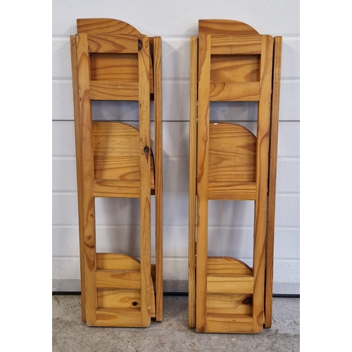 1403 - 2 pine 3 tier corner folding shelves. Each approx. 94cm x 26cm.