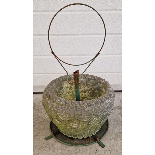 1469 - A concrete garden planter with banded leaf pattern, with a green metal frame. Planter approx. 22cm t... 