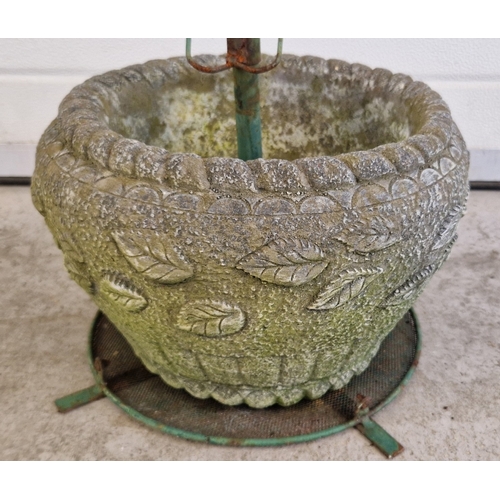 1469 - A concrete garden planter with banded leaf pattern, with a green metal frame. Planter approx. 22cm t... 