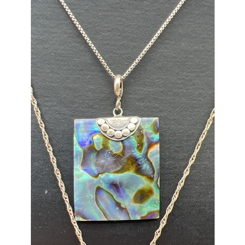 1029 - 2 silver and shell pendant necklaces on silver chains. A Square abalone shell pendant with silver ca... 