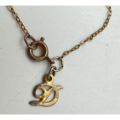 1085 - A vintage gilt sterling silver necklace by Danecraft. A circular pendant with starfish design and ha... 