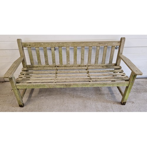 1476 - A wooden slatted garden bench. Approx. 157.5cm long.