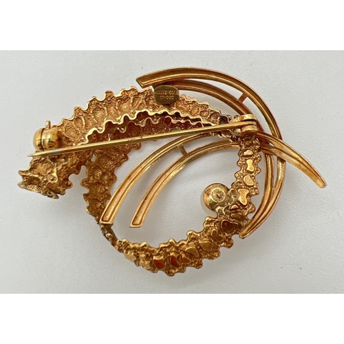 1126 - A vintage 1960's rolled gold brooch set with a single pearl. Retro twist and swirl design with both ... 