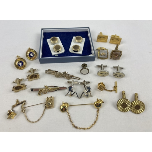 1141 - A small collection of vintage and modern cuff links, tie pins and shirt button covers. To include mo... 