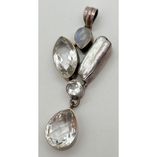 1154 - A large modern design silver pendant set with clear quartz, moonstone and a Keshi pearl. A marquise,... 