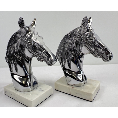 1260 - A pair of modern cast metal horse head figures mounted on square shaped marble bases. Each approx. 2... 