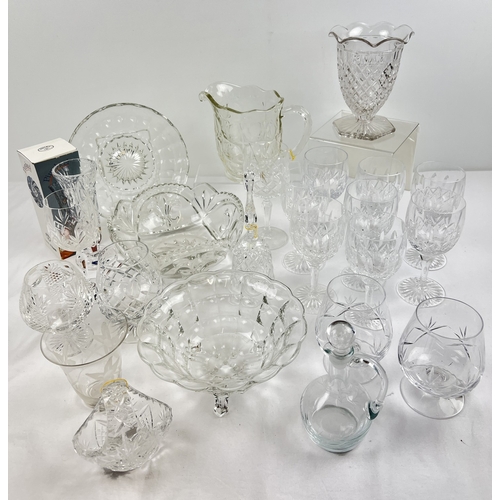 1307 - A collection of assorted cut clear glass and crystal to include a set of 8 wine glasses, brandy snif... 