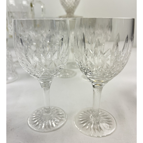 1307 - A collection of assorted cut clear glass and crystal to include a set of 8 wine glasses, brandy snif... 