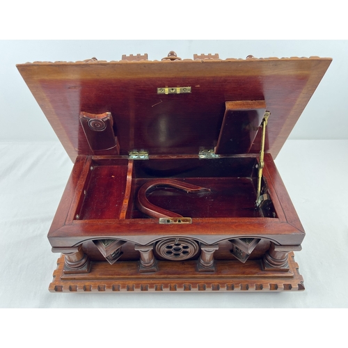 1358 - An antique rosewood large bespoke made puzzle box modelled as a castle, with several secret compartm... 