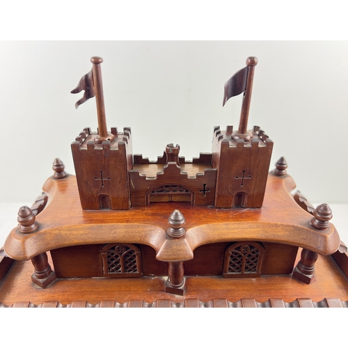 1358 - An antique rosewood large bespoke made puzzle box modelled as a castle, with several secret compartm... 