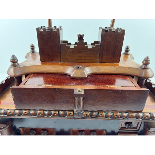 1358 - An antique rosewood large bespoke made puzzle box modelled as a castle, with several secret compartm... 