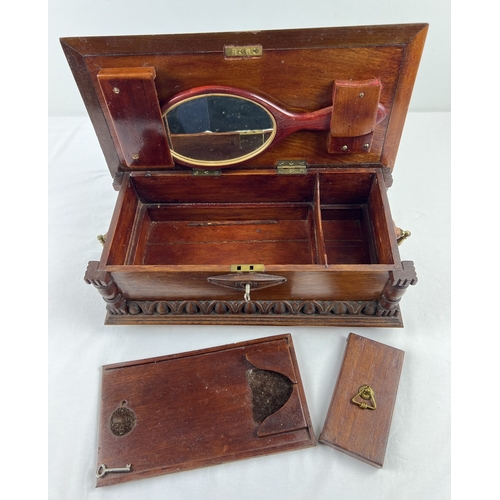 1359 - An antique dark wood bespoke made lockable vanity box with carved and inlaid detail. Raised on bun f... 