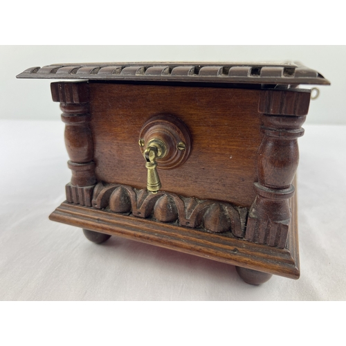 1359 - An antique dark wood bespoke made lockable vanity box with carved and inlaid detail. Raised on bun f... 