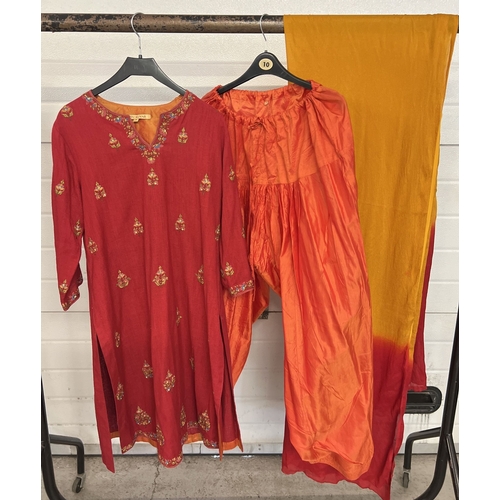 1382 - A red linen mix Indian Kameez tunic with floral embroidery throughout, with a pair of orange shot si... 