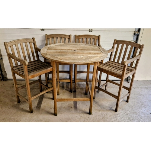 1423 - A wooden slatted bar table with central hole for parasol, and 4 matching arm chairs. 1 stretcher mis... 