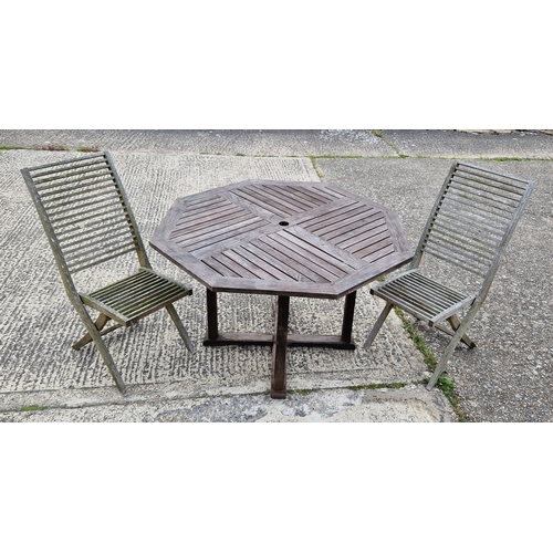 1455 - An octagonal shaped 2 sectional wooden garden table - top lifts off. Together with a pair of 'Intert... 