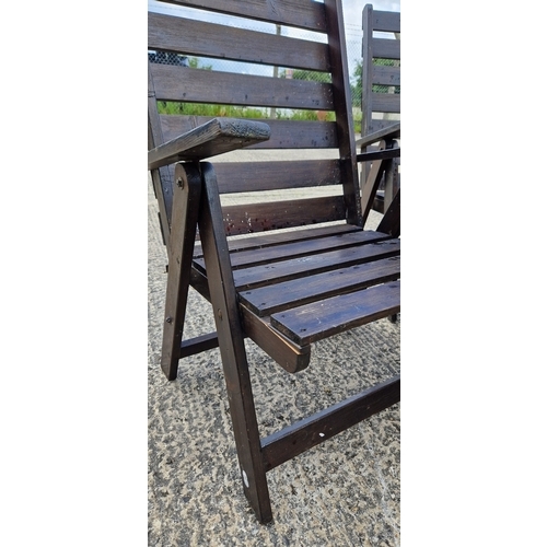 1459 - A wooden slatted folding garden table and 4 matching armchairs, painted brown. Damage to 1 chair, on... 