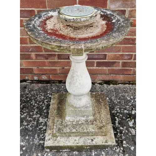 1468 - A large concrete garden bird bath with sundial (upright missing), raised on a turned pedestal with s... 