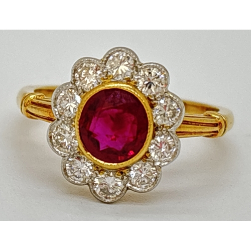 1 - A ruby and diamond cluster ring comprised of a central oval cut ruby with a surround of ten platinum... 