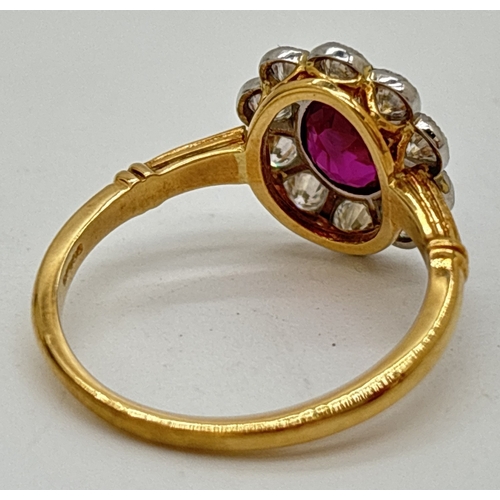 1 - A ruby and diamond cluster ring comprised of a central oval cut ruby with a surround of ten platinum... 