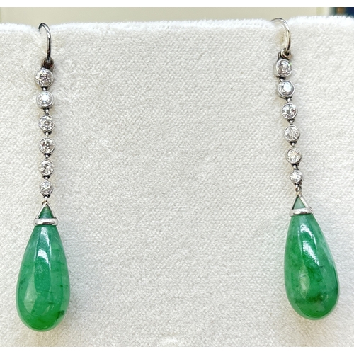 3 - A pair of white metal Art Deco diamond and jade drop earrings with hook posts. Each earring comprise... 