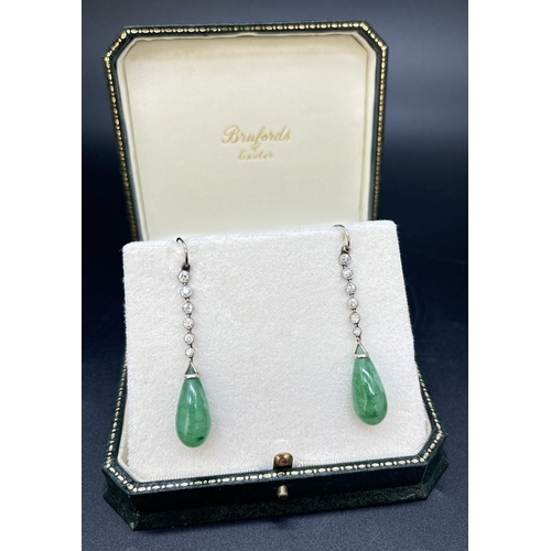 3 - A pair of white metal Art Deco diamond and jade drop earrings with hook posts. Each earring comprise... 