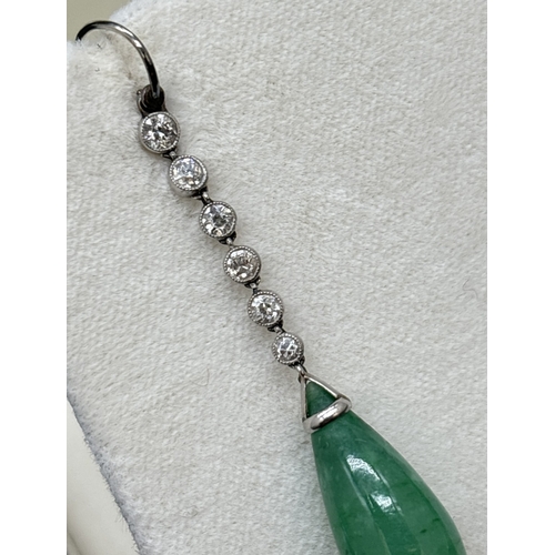 3 - A pair of white metal Art Deco diamond and jade drop earrings with hook posts. Each earring comprise... 