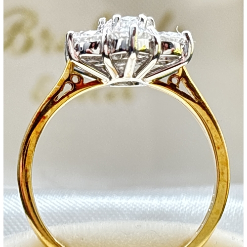 5 - A 18ct gold seven stone brilliant cut diamond flower design cluster ring. Stones in 18ct white gold ... 