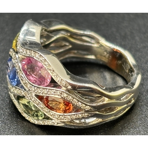 6 - An 18ct white gold multi-coloured sapphire and diamond bomb style cocktail ring from the Flamme Coll... 