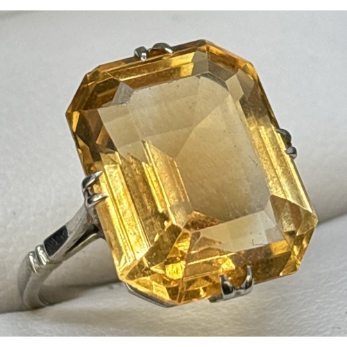 9 - A vintage 9ct white gold and citrine cocktail ring, double claw prong set with a large emerald cut a... 