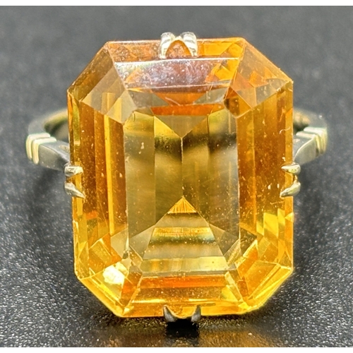 9 - A vintage 9ct white gold and citrine cocktail ring, double claw prong set with a large emerald cut a... 