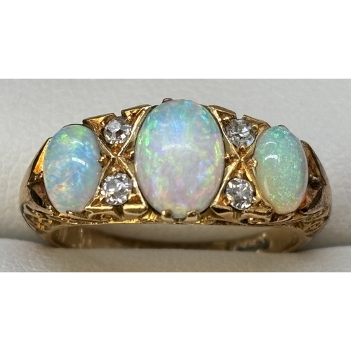 10 - An Edwardian 18ct yellow gold opal and diamond ring. 3 oval cut opals and 4 small round cut diamonds... 