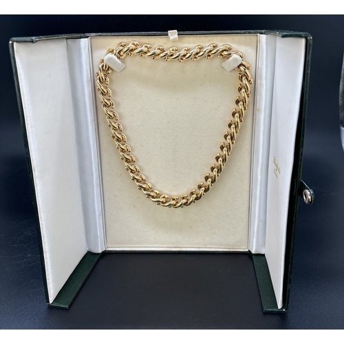 13 - A boxed 18ct gold large 