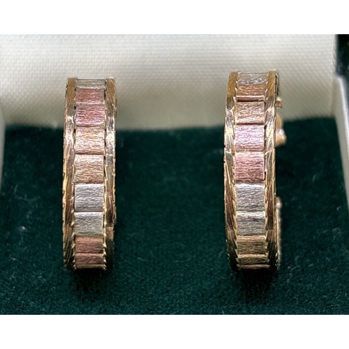 18 - A pair of 9ct tri coloured gold hoop style earrings. 17 small square brushed yellow, rose and white ... 