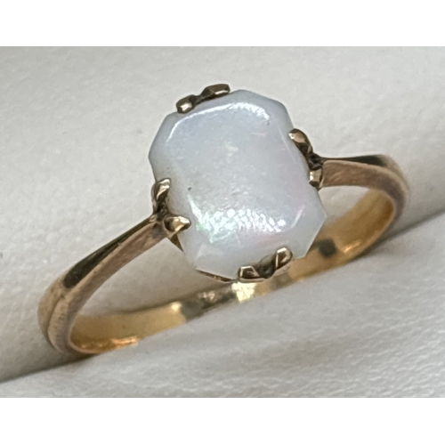 32 - A vintage 9ct gold square cut opal dress ring with pronged claw setting. Gold mark inside band. Opal... 