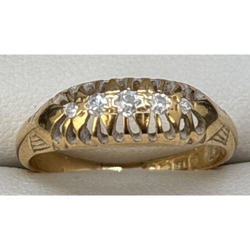 33 - An Edwardian 18ct gold 5 stone diamond ring. Graduating sized stones set in a pierced work mount wit... 