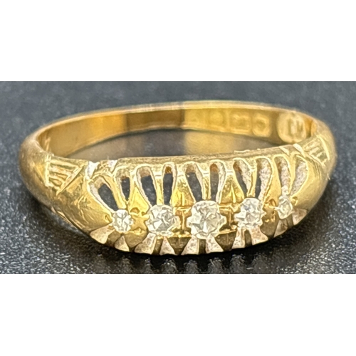 33 - An Edwardian 18ct gold 5 stone diamond ring. Graduating sized stones set in a pierced work mount wit... 