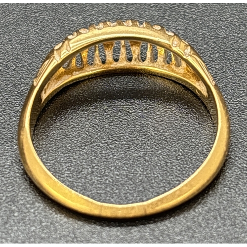 33 - An Edwardian 18ct gold 5 stone diamond ring. Graduating sized stones set in a pierced work mount wit... 