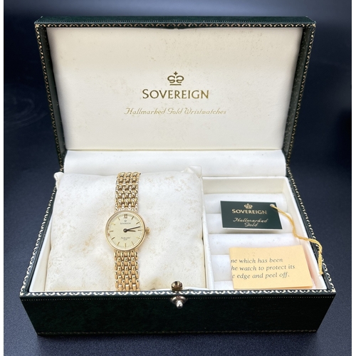 37 - A boxed 9ct gold ladies wristwatch by Sovereign. Flat link bracelet strap with clip fastening. Circu... 